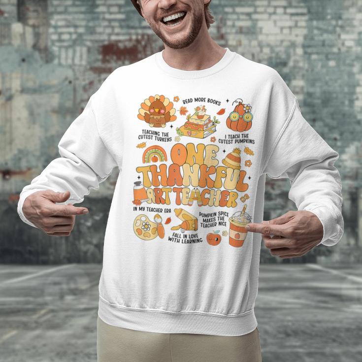 Thanksgiving One Thankful Art Teacher Fall Groovy Men Women Unisex Sweatshirt, Groovy Teacher Sweatshirts, gift for family, gift for coworker Thanksgiving One Thankful Art Teacher Fall Groovy Men Women Unisex Sweatshirt, Groovy Teacher Sweatshirts, gift for family, gift for coworker