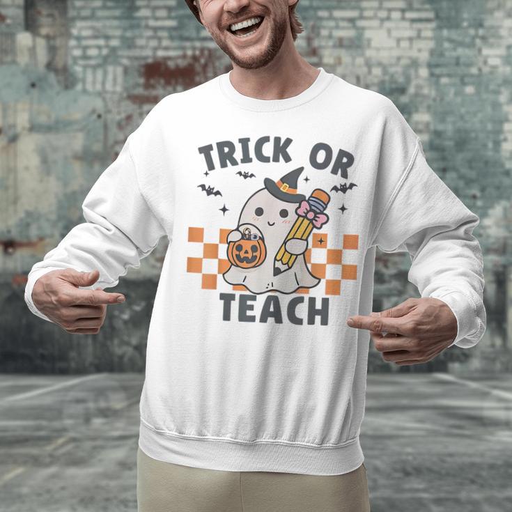 Trick Or Teach Teacher Unisex Sweatshirt, gift for family, gift for coworker Trick Or Teach Teacher Unisex Sweatshirt, gift for family, gift for coworker