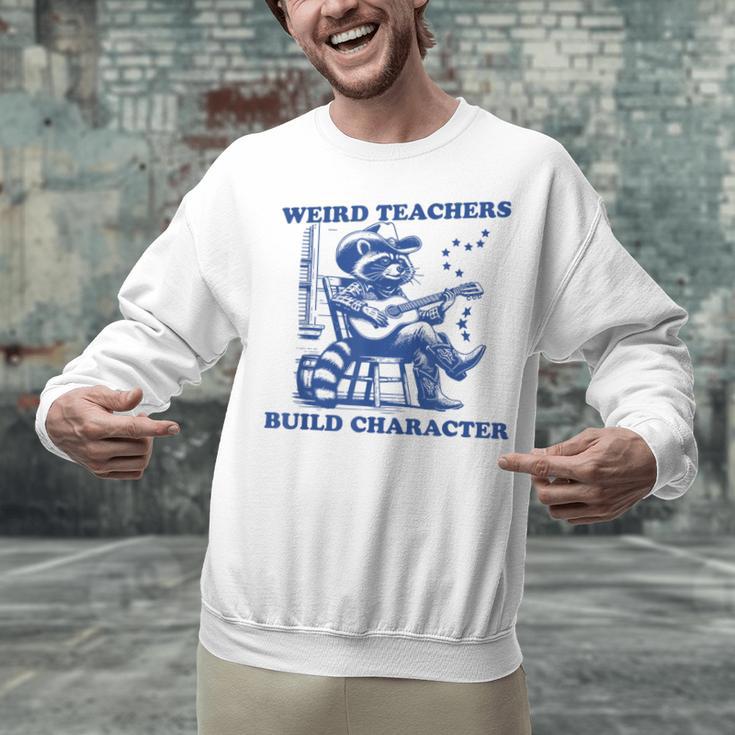 Weird Teachers Build Character Shirt Raccoon Teacher Unisex Sweatshirt, gift for family, gift for coworker Weird Teachers Build Character Shirt Raccoon Teacher Unisex Sweatshirt, gift for family, gift for coworker