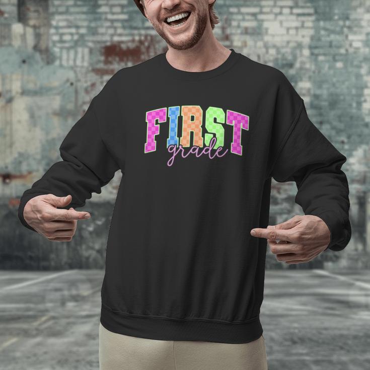 Back To School Neon Checkered First Grade Colorful Teacher Men Graphic Sweatshirt, First Grade Teacher Sweatshirts, gift for family, gift for coworker Back To School Neon Checkered First Grade Colorful Teacher Men Graphic Sweatshirt, First Grade Teacher Sweatshirts, gift for family, gift for coworker