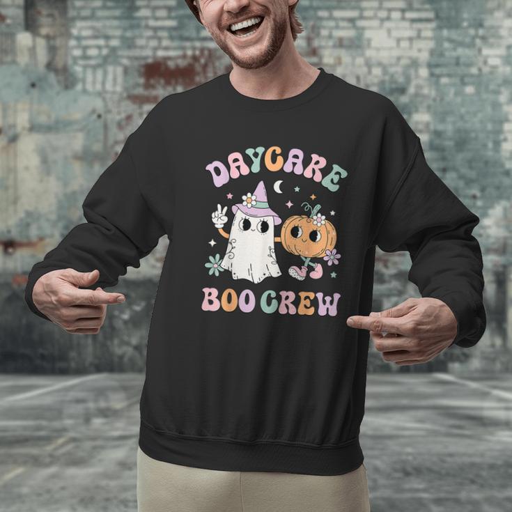 Daycare Boo Crew Groovy Halloween Floral Ghost Kid Teacher Men Graphic Sweatshirt, Groovy Teacher Sweatshirts, gift for family, gift for coworker