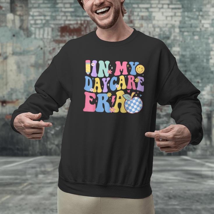 In My Daycare Era Groovy Teacher Daycare First Day Of School Men Graphic Sweatshirt, Groovy Teacher Sweatshirts, gift for family, gift for coworker