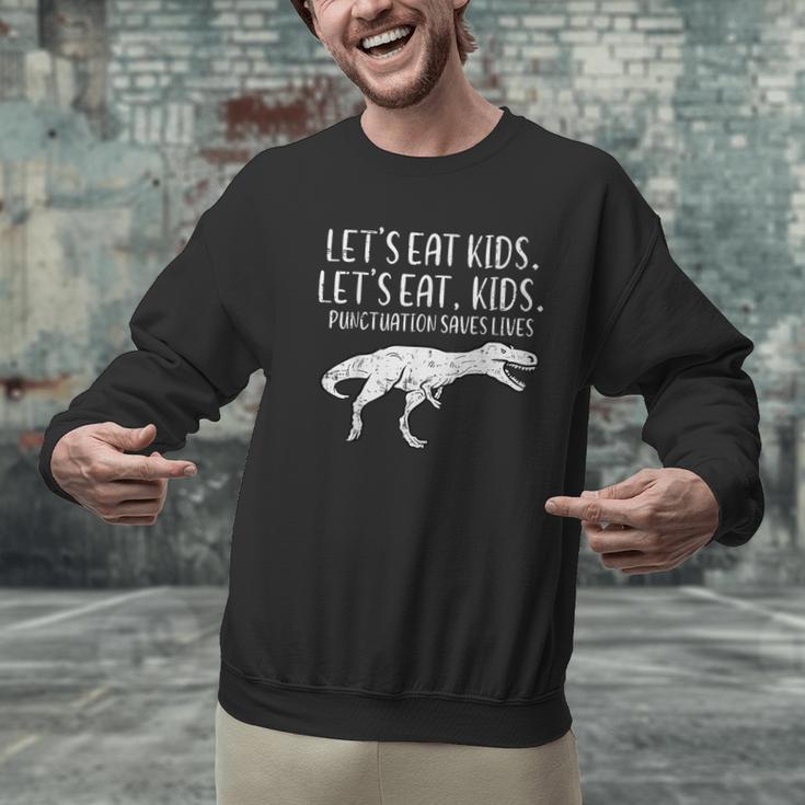 Lets Eat Kids Punctuation Saves Lives Dino Teacher Men Men Graphic Sweatshirt, gift for family, gift for coworker Lets Eat Kids Punctuation Saves Lives Dino Teacher Men Men Graphic Sweatshirt, gift for family, gift for coworker
