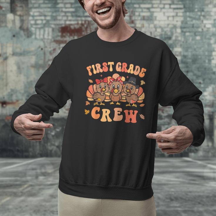 First Grade Crew Thanksgiving Fall Teacher 1st Grade Team Men Graphic Sweatshirt, First Grade Teacher Sweatshirts, gift for family, gift for coworker
