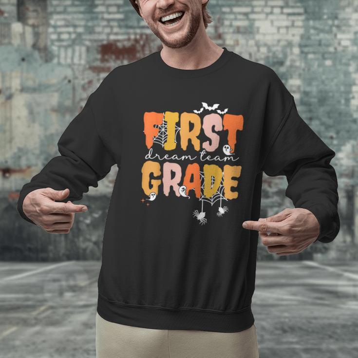 First Grade Dream Retro Team Fall Halloween Spooky Teachers Men Graphic Sweatshirt, First Grade Teacher Sweatshirts, gift for family, gift for coworker
