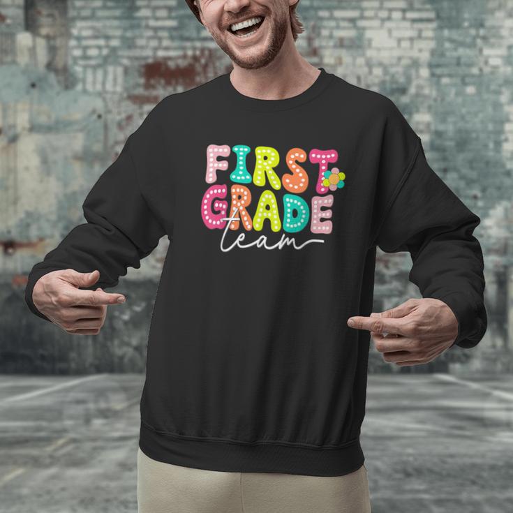 First Grade Team Teacher Back To School 1st Grade Squad Kids Men Graphic Sweatshirt, First Grade Teacher Sweatshirts, gift for family, gift for coworker