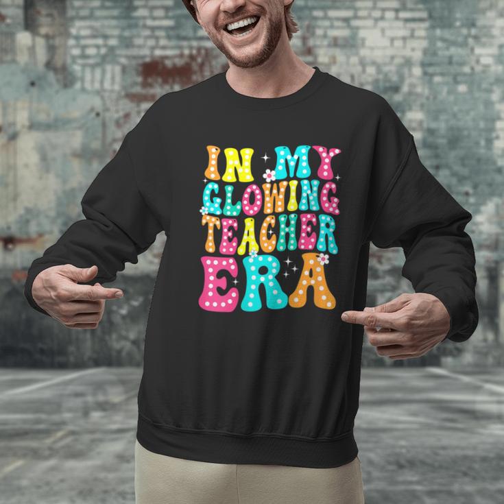 In My Glowing Teacher Era Groovy Colorful Bright Men Graphic Sweatshirt, Groovy Teacher Sweatshirts, gift for family, gift for coworker In My Glowing Teacher Era Groovy Colorful Bright Men Graphic Sweatshirt, Groovy Teacher Sweatshirts, gift for family, gift for coworker