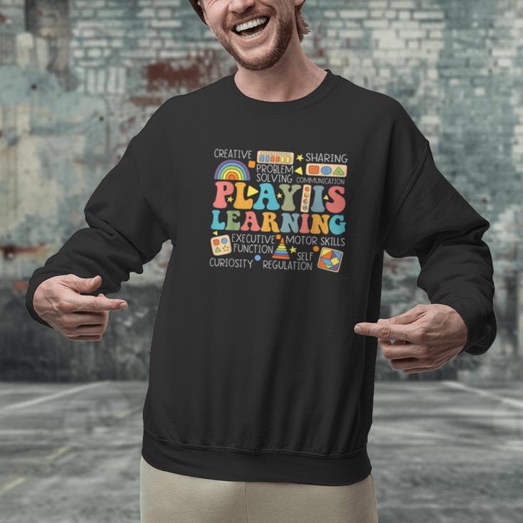 Groovy Play Is Learning Kindergarten Teacher Appreciation Men Graphic Sweatshirt, Groovy Teacher Sweatshirts, gift for family, gift for coworker Groovy Play Is Learning Kindergarten Teacher Appreciation Men Graphic Sweatshirt, Groovy Teacher Sweatshirts, gift for family, gift for coworker
