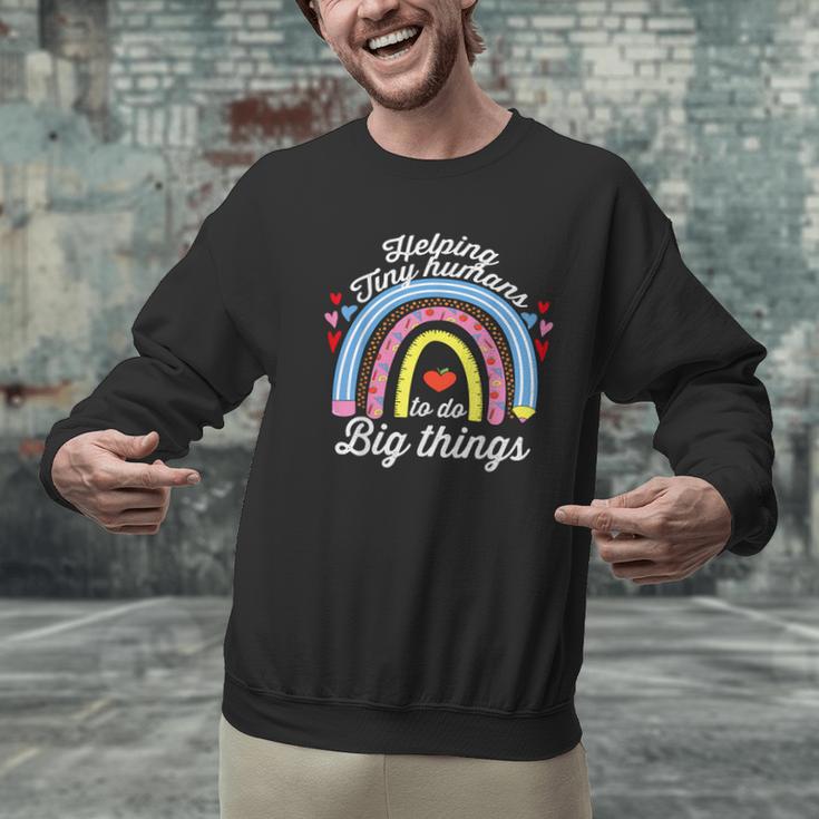 Helping Tiny Humans To Do Big Things Teacher Women Men Graphic Sweatshirt, gift for family, gift for coworker Helping Tiny Humans To Do Big Things Teacher Women Men Graphic Sweatshirt, gift for family, gift for coworker