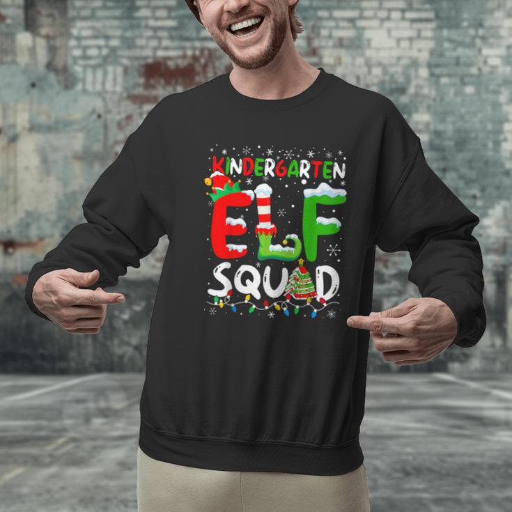 Kindergarten ELF Squad Christmas ELF Student Teacher Men Women Kids Men Graphic Sweatshirt, gift for family, gift for coworker Kindergarten ELF Squad Christmas ELF Student Teacher Men Women Kids Men Graphic Sweatshirt, gift for family, gift for coworker