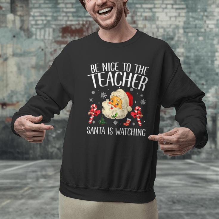 Be Nice To The Teacher Santa Is Watching School Christmas Men Graphic Sweatshirt, gift for family, gift for coworker Be Nice To The Teacher Santa Is Watching School Christmas Men Graphic Sweatshirt, gift for family, gift for coworker