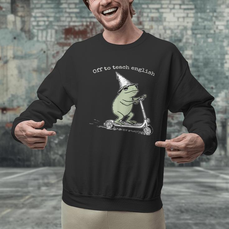 Off To Teach English Scooter Frog ESL Teacher Literature Men Graphic Sweatshirt, Esl Teacher Sweatshirts, English Teacher Sweatshirts, gift for family, gift for coworker Off To Teach English Scooter Frog ESL Teacher Literature Men Graphic Sweatshirt, Esl Teacher Sweatshirts, English Teacher Sweatshirts, gift for family, gift for coworker
