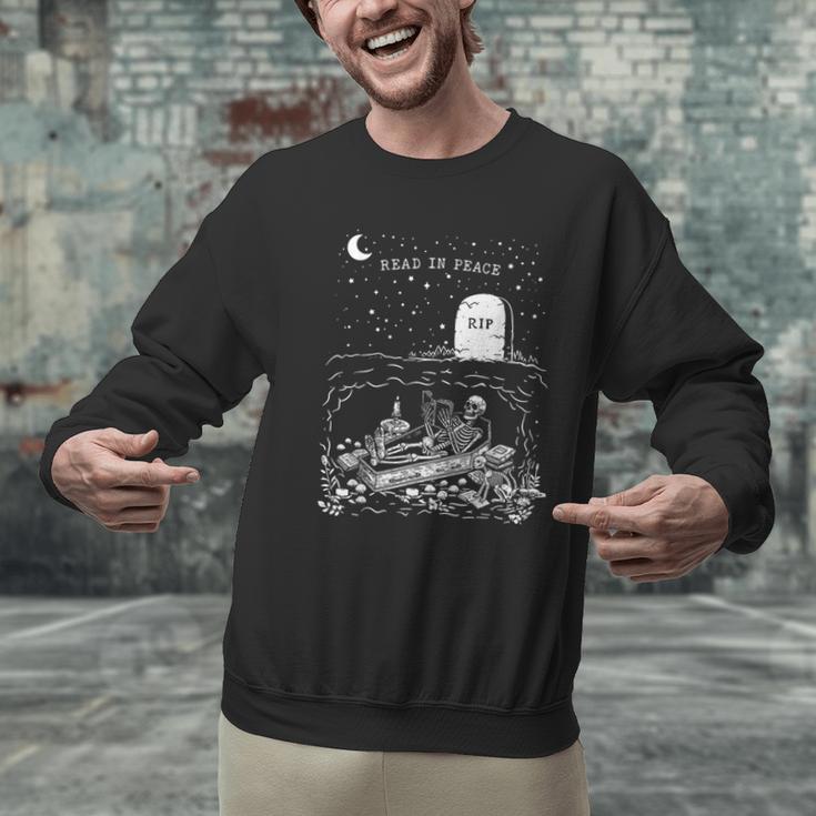 Read In Peace Skeleton Halloween Book Reading Spooky Teacher Men Graphic Sweatshirt, gift for family, gift for coworker Read In Peace Skeleton Halloween Book Reading Spooky Teacher Men Graphic Sweatshirt, gift for family, gift for coworker