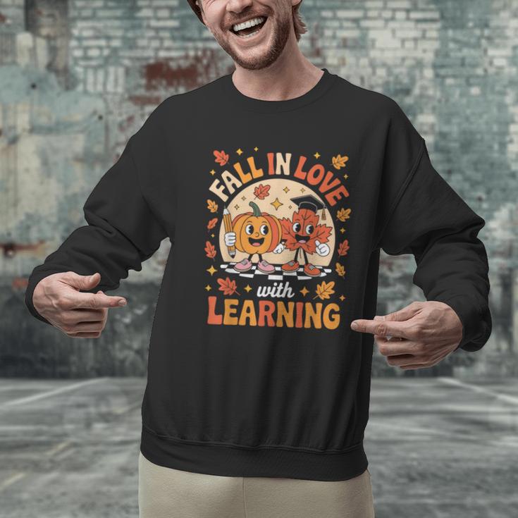 Retro Fall In Love With Learning Pumpkin Leaf Teacher Autumn Men Graphic Sweatshirt, gift for family, gift for coworker Retro Fall In Love With Learning Pumpkin Leaf Teacher Autumn Men Graphic Sweatshirt, gift for family, gift for coworker