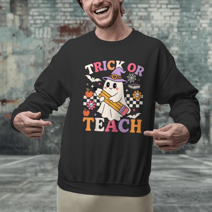 Retro Floral Ghost Trick Or Teach Groovy Teacher Halloween Men Graphic Sweatshirt, Groovy Teacher Sweatshirts, gift for family, gift for coworker Retro Floral Ghost Trick Or Teach Groovy Teacher Halloween Men Graphic Sweatshirt, Groovy Teacher Sweatshirts, gift for family, gift for coworker