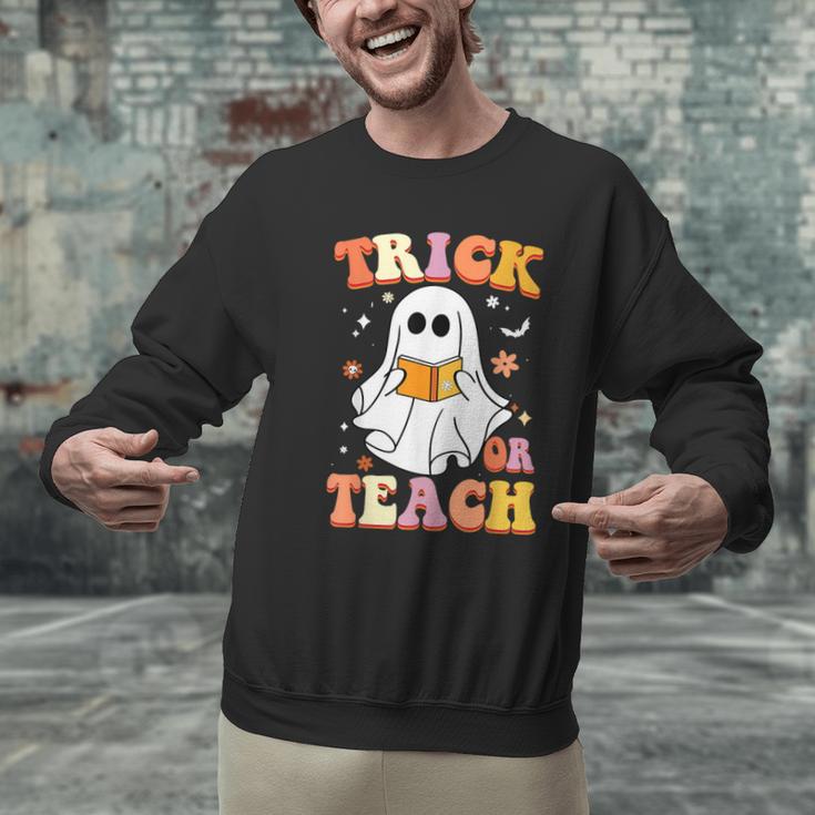Retro Vintage Groovy Trick Or Teach Teacher Halloween For Men Women Kids Men Graphic Sweatshirt, Groovy Teacher Sweatshirts, gift for family, gift for coworker