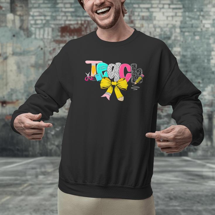 Teach Coquette Bow Teacher Back To School Happy First Day Men Graphic Sweatshirt, gift for family, gift for coworker Teach Coquette Bow Teacher Back To School Happy First Day Men Graphic Sweatshirt, gift for family, gift for coworker