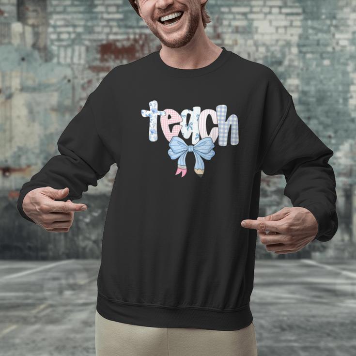 Teach Teacher Coquette Bow Pencil Back To School First Day Men Graphic Sweatshirt, gift for family, gift for coworker Teach Teacher Coquette Bow Pencil Back To School First Day Men Graphic Sweatshirt, gift for family, gift for coworker