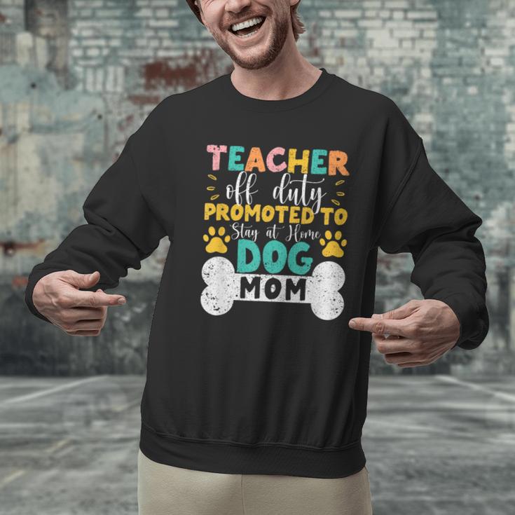 Teacher Off Duty Promoted To Stay At Home Dog Mom Teachers Men Graphic Sweatshirt, gift for family, gift for coworker Teacher Off Duty Promoted To Stay At Home Dog Mom Teachers Men Graphic Sweatshirt, gift for family, gift for coworker