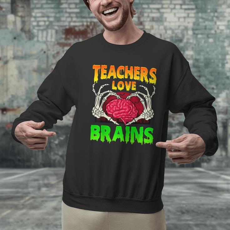 Teacher Teachers Love Brains Skeleton Hand Heart Halloween Men Graphic Sweatshirt, gift for family, gift for coworker Teacher Teachers Love Brains Skeleton Hand Heart Halloween Men Graphic Sweatshirt, gift for family, gift for coworker