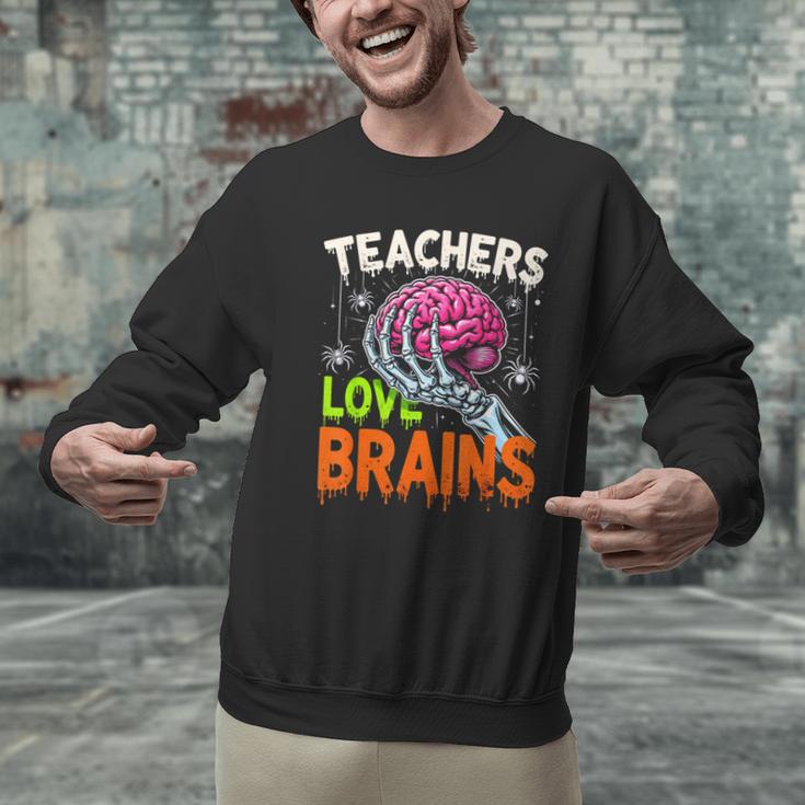 Teachers Love Brains Halloween 2025 Skeleton Costume Men Graphic Sweatshirt, gift for family, gift for coworker Teachers Love Brains Halloween 2025 Skeleton Costume Men Graphic Sweatshirt, gift for family, gift for coworker