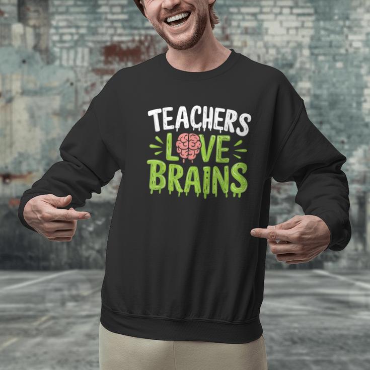 Teachers Love Brains Halloween Teacher Zombie Men Graphic Sweatshirt, gift for family, gift for coworker Teachers Love Brains Halloween Teacher Zombie Men Graphic Sweatshirt, gift for family, gift for coworker