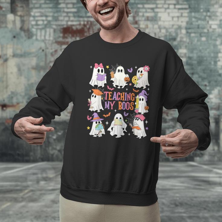 Teaching My Boos Teacher Cute Ghost Groovy Teacher Halloween Men Graphic Sweatshirt, Groovy Teacher Sweatshirts, gift for family, gift for coworker Teaching My Boos Teacher Cute Ghost Groovy Teacher Halloween Men Graphic Sweatshirt, Groovy Teacher Sweatshirts, gift for family, gift for coworker