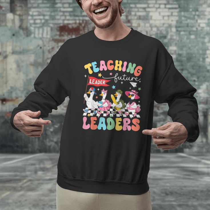 Teaching Future Leaders Groovy Teacher Back To School Men Graphic Sweatshirt, Future Teacher Sweatshirts, Groovy Teacher Sweatshirts, gift for family, gift for coworker Teaching Future Leaders Groovy Teacher Back To School Men Graphic Sweatshirt, Future Teacher Sweatshirts, Groovy Teacher Sweatshirts, gift for family, gift for coworker