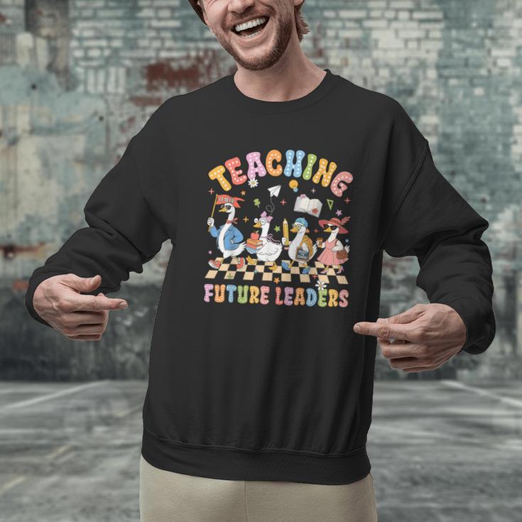 Teaching Future Leaders Teacher Back To School Cute Goose Men Graphic Sweatshirt, Future Teacher Sweatshirts, gift for family, gift for coworker Teaching Future Leaders Teacher Back To School Cute Goose Men Graphic Sweatshirt, Future Teacher Sweatshirts, gift for family, gift for coworker
