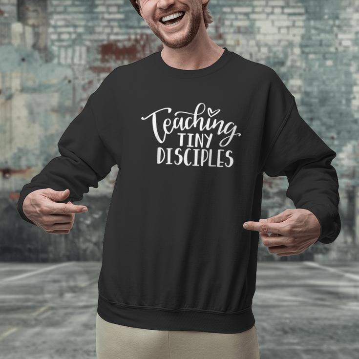 Teaching Tiny Disciples Christian Teacher Men Graphic Sweatshirt, gift for family, gift for coworker Teaching Tiny Disciples Christian Teacher Men Graphic Sweatshirt, gift for family, gift for coworker