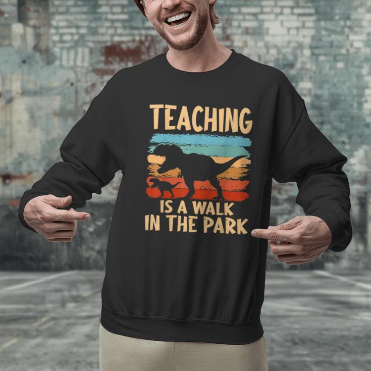 Teaching Is a Walk In Park Dinosaur Teacher Men Graphic Sweatshirt, gift for family, gift for coworker Teaching Is a Walk In Park Dinosaur Teacher Men Graphic Sweatshirt, gift for family, gift for coworker
