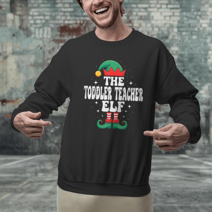 The Toddler Teacher Elf Christmas Matching Family Men Graphic Sweatshirt, gift for family, gift for coworker The Toddler Teacher Elf Christmas Matching Family Men Graphic Sweatshirt, gift for family, gift for coworker