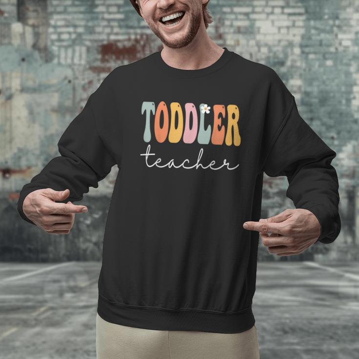 Toddler Teacher Retro Groovy Women Happy First Day Of School Men Graphic Sweatshirt, Groovy Teacher Sweatshirts, gift for family, gift for coworker