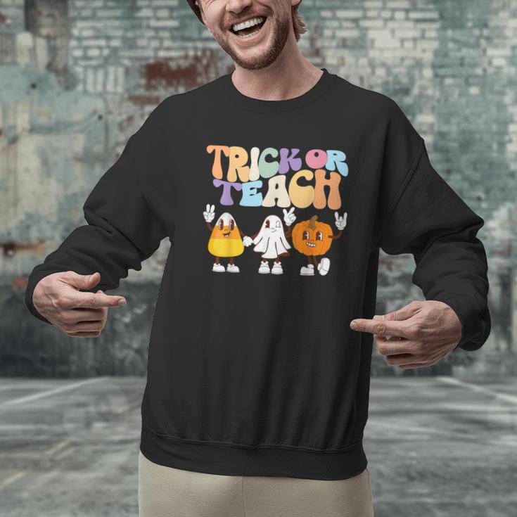 Trick Or Teach Cute Halloween Teacher Men Graphic Sweatshirt, gift for family, gift for coworker Trick Or Teach Cute Halloween Teacher Men Graphic Sweatshirt, gift for family, gift for coworker