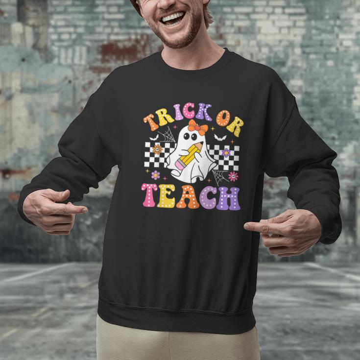 Trick Or Teach Groovy Halloween Teachers Men Graphic Sweatshirt, gift for family, gift for coworker Trick Or Teach Groovy Halloween Teachers Men Graphic Sweatshirt, gift for family, gift for coworker