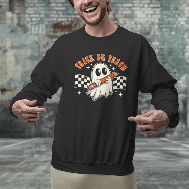 Trick Or Teach Groovy Retro Ghost Halloween Teacher Kids Men Graphic Sweatshirt, Groovy Teacher Sweatshirts, gift for family, gift for coworker