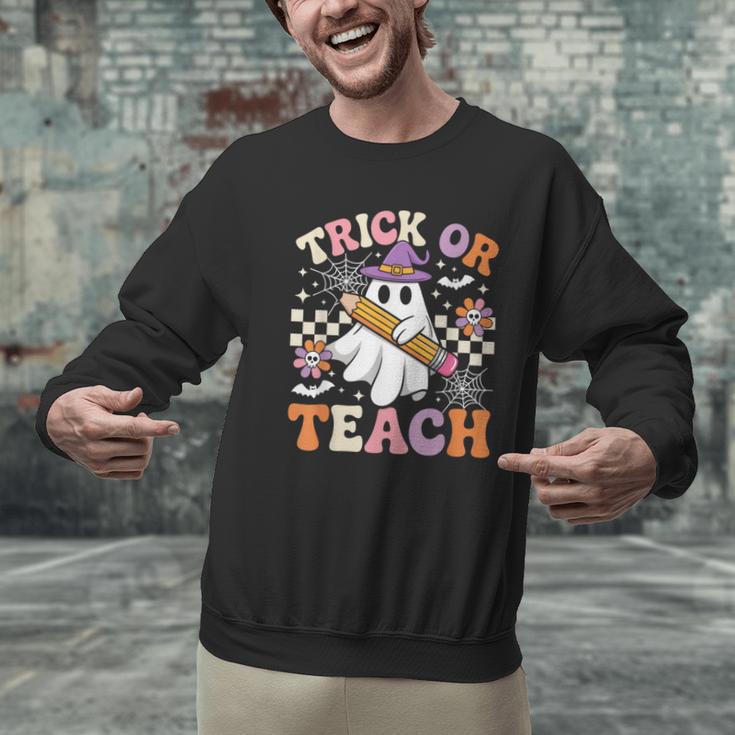 Trick Or Teach Groovy Teacher Halloween Retro Ghost Men Graphic Sweatshirt, Groovy Teacher Sweatshirts, gift for family, gift for coworker Trick Or Teach Groovy Teacher Halloween Retro Ghost Men Graphic Sweatshirt, Groovy Teacher Sweatshirts, gift for family, gift for coworker