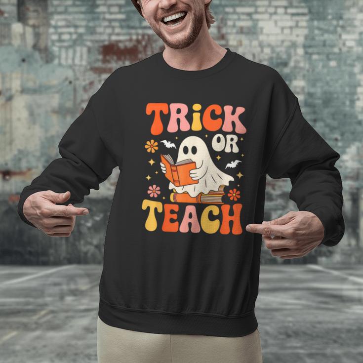 Trick Or Teach Halloween Shirt For Teacher Kids Floral Ghost Men Graphic Sweatshirt, gift for family, gift for coworker Trick Or Teach Halloween Shirt For Teacher Kids Floral Ghost Men Graphic Sweatshirt, gift for family, gift for coworker