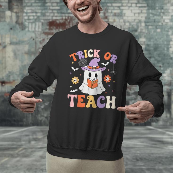 Trick Or Teach Teacher Groovy Ghost Halloween Teacher Men Graphic Sweatshirt, Groovy Teacher Sweatshirts, gift for family, gift for coworker
