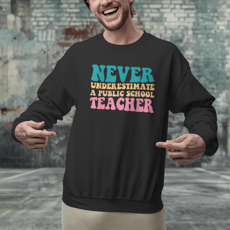 Never Underestimate A Public School Teacher Groovy Women Men Graphic Sweatshirt, Groovy Teacher Sweatshirts, gift for family, gift for coworker Never Underestimate A Public School Teacher Groovy Women Men Graphic Sweatshirt, Groovy Teacher Sweatshirts, gift for family, gift for coworker