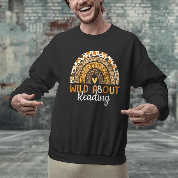 Wild About Reading Teacher Back To School Leopard Rainbow Men Graphic Sweatshirt, gift for family, gift for coworker Wild About Reading Teacher Back To School Leopard Rainbow Men Graphic Sweatshirt, gift for family, gift for coworker