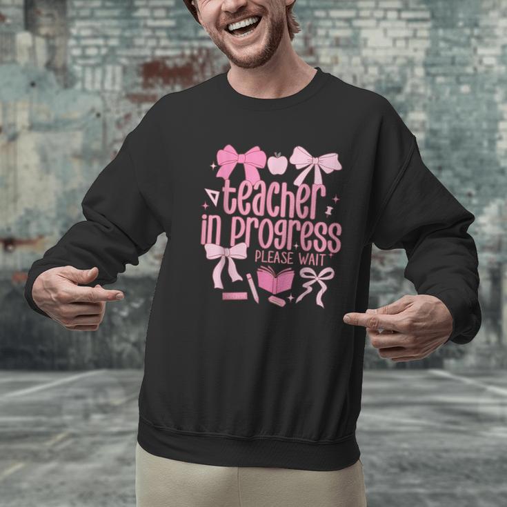 Women Teacher In Progress Coquette Pink Bow Future Teacher Men Graphic Sweatshirt, Future Teacher Sweatshirts, gift for family, gift for coworker Women Teacher In Progress Coquette Pink Bow Future Teacher Men Graphic Sweatshirt, Future Teacher Sweatshirts, gift for family, gift for coworker