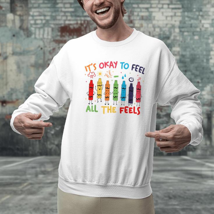 Its Okay To Feel All The Feels Mood Color Crayons Teacher Men Graphic Sweatshirt, gift for family, gift for coworker Its Okay To Feel All The Feels Mood Color Crayons Teacher Men Graphic Sweatshirt, gift for family, gift for coworker