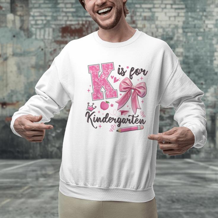 K Is For Kindergarten Teacher Coquette Bow Back To School Men Graphic Sweatshirt, gift for family, gift for coworker K Is For Kindergarten Teacher Coquette Bow Back To School Men Graphic Sweatshirt, gift for family, gift for coworker