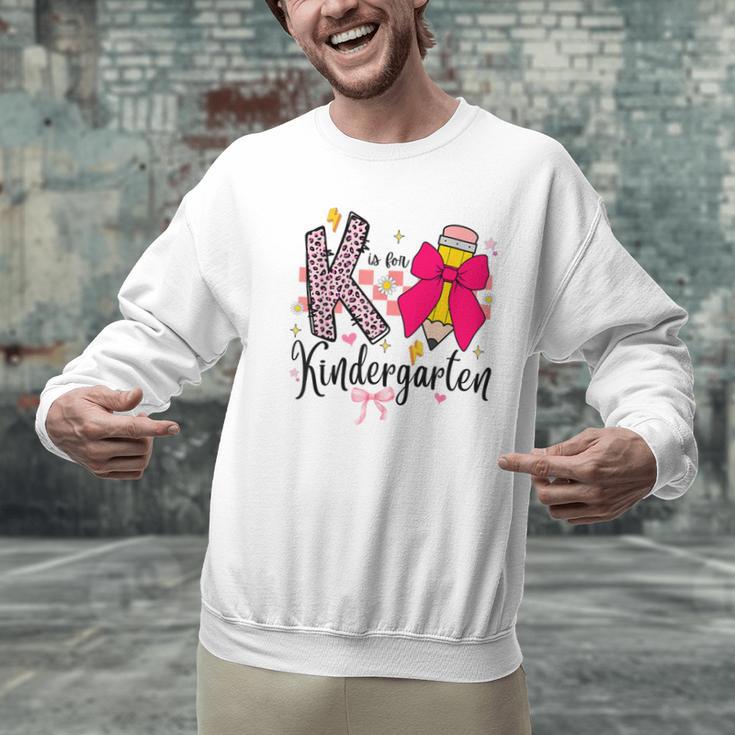 K Is For Kindergarten Teacher Coquette Bow Back To School Men Graphic Sweatshirt, gift for family, gift for coworker K Is For Kindergarten Teacher Coquette Bow Back To School Men Graphic Sweatshirt, gift for family, gift for coworker