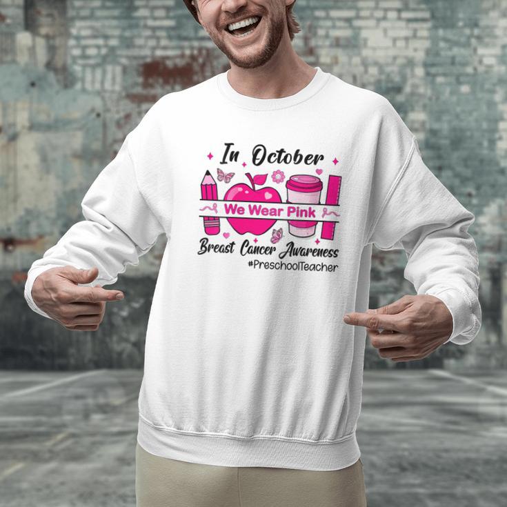 Preschool Teacher In October We Wear Pink Breast Cancer Men Graphic Sweatshirt, gift for family, gift for coworker Preschool Teacher In October We Wear Pink Breast Cancer Men Graphic Sweatshirt, gift for family, gift for coworker