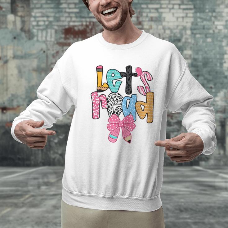 Lets Read Reading Teacher Back To School Literacy Pencil Bow Men Graphic Sweatshirt, gift for family, gift for coworker Lets Read Reading Teacher Back To School Literacy Pencil Bow Men Graphic Sweatshirt, gift for family, gift for coworker
