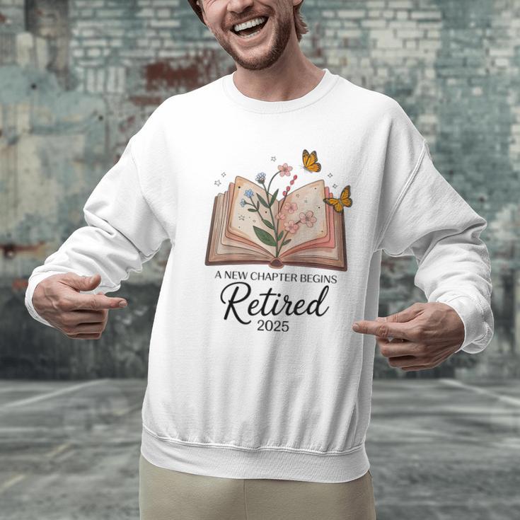 Retired 2025 A New Chapter Begins Retirement Teacher Book Men Graphic Sweatshirt, gift for family, gift for coworker Retired 2025 A New Chapter Begins Retirement Teacher Book Men Graphic Sweatshirt, gift for family, gift for coworker