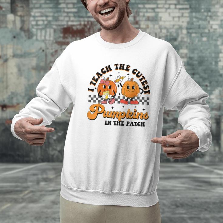 I Teach The Cutest Pumpkins In The Patch Halloween Teacher For Men Women Kids Men Graphic Sweatshirt, gift for family, gift for coworker I Teach The Cutest Pumpkins In The Patch Halloween Teacher For Men Women Kids Men Graphic Sweatshirt, gift for family, gift for coworker