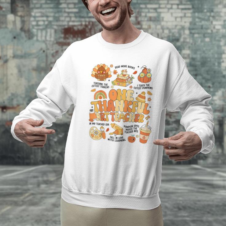 Thanksgiving One Thankful Art Teacher Fall Groovy Men Women Men Graphic Sweatshirt, Groovy Teacher Sweatshirts, gift for family, gift for coworker Thanksgiving One Thankful Art Teacher Fall Groovy Men Women Men Graphic Sweatshirt, Groovy Teacher Sweatshirts, gift for family, gift for coworker